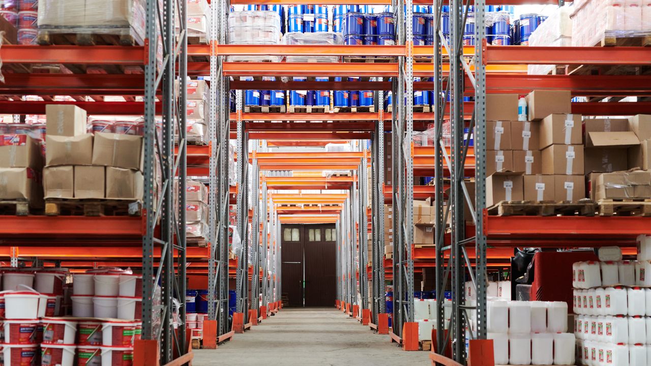 Warehouse aisle with pallet racks and industrial inventory