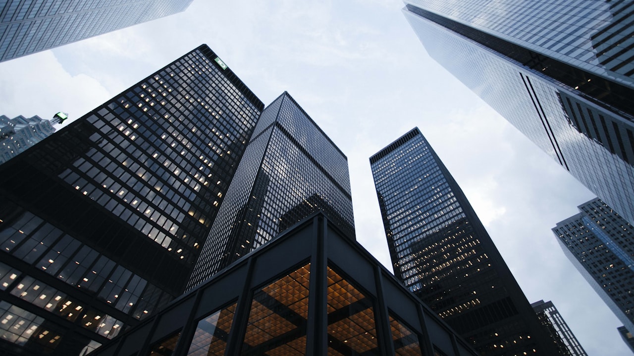Modern glass skyscrapers reflecting a national corporate brand presence