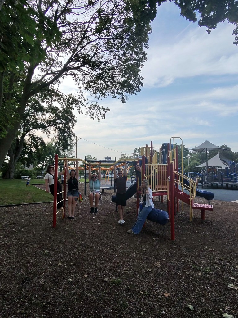 Haley Marketing teammates hanging out on a playground during a team outing