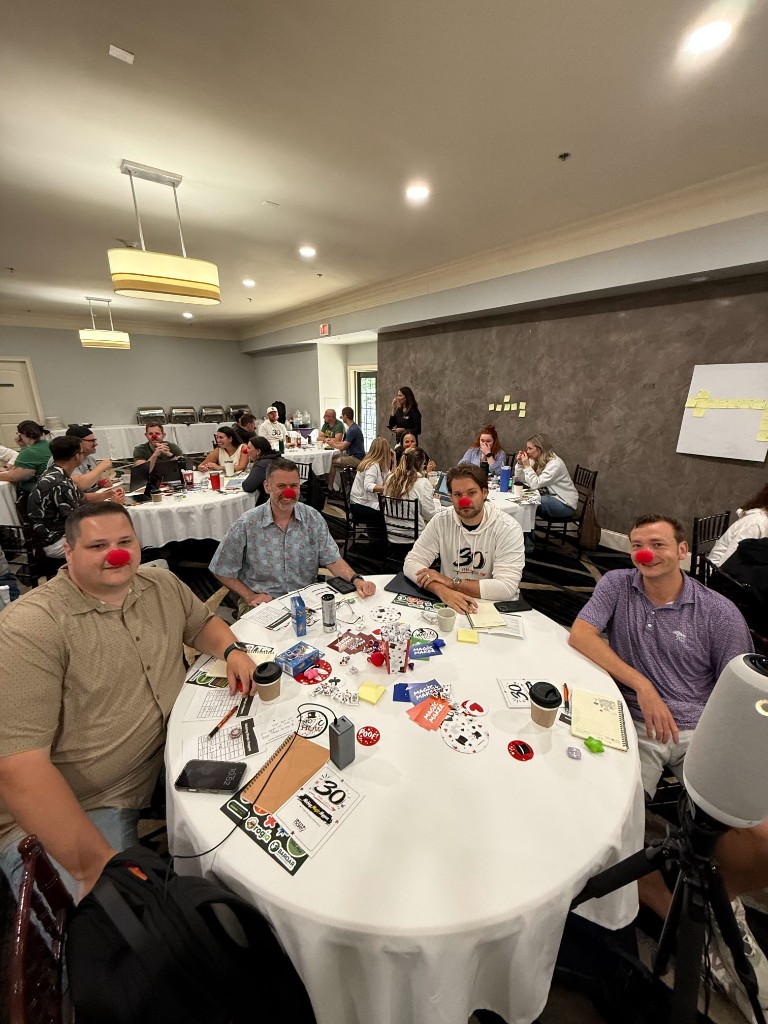 Haley Marketing teammates at a workshop table during a company celebration